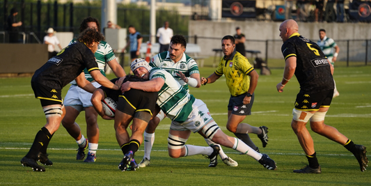 MLR Round 1 action – Houston SaberCats player tackled by Chicago Hounds defenders during the 2025 Major League Rugby season opener.